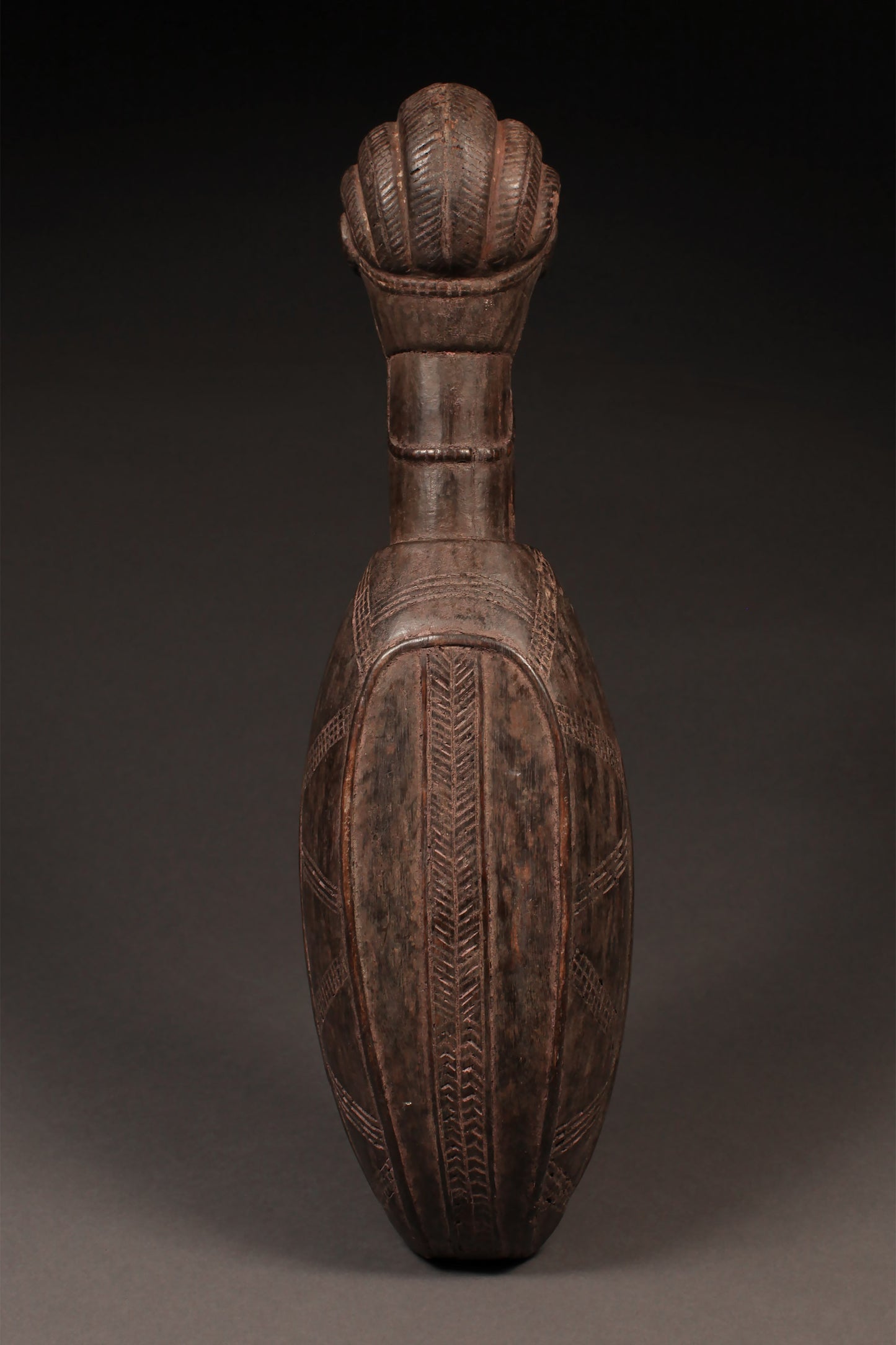 Tribal Objects - African Tribal Art - Ancient Ceremonial Art - Handcrafted Artifacts - Masks - Wood Sculptures - Iron Bronze Objects - Textiles - Art Pieces - African Folk Art - This authentic Ceremonial Ladle Spoon from the Dan Tribe in Liberia, Ivory Coast is carved from wood and features unique figures and artifacts. An ideal piece for collectors, the spoon is a great way to commemorate traditional culture. 22" x 6.25" Inventory # 10308