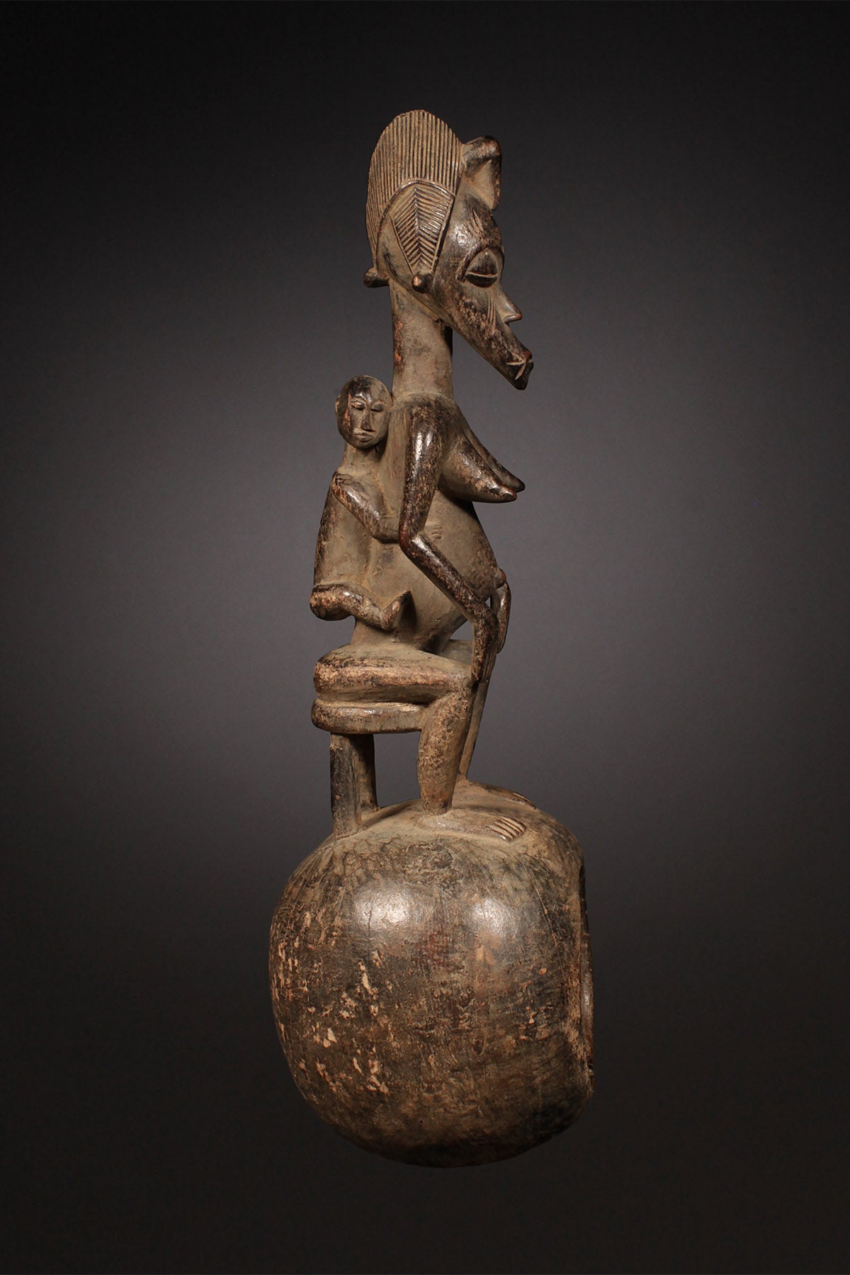 Tribal Objects - African Tribal Art - Ancient Ceremonial Art - Handcrafted Artifacts - Masks - Wood Sculptures - Iron Bronze Objects - Textiles - Art Pieces - African Folk Art - This Senufo Ceremonial Spoon and Maternity Figure is a unique collectible from the Senufo Tribe of the Ivory Coast. Crafted by hand with wood and featuring a maternity figure, this piece is an excellent addition to any African artifact collection. H: 16" Inventory # 10398
