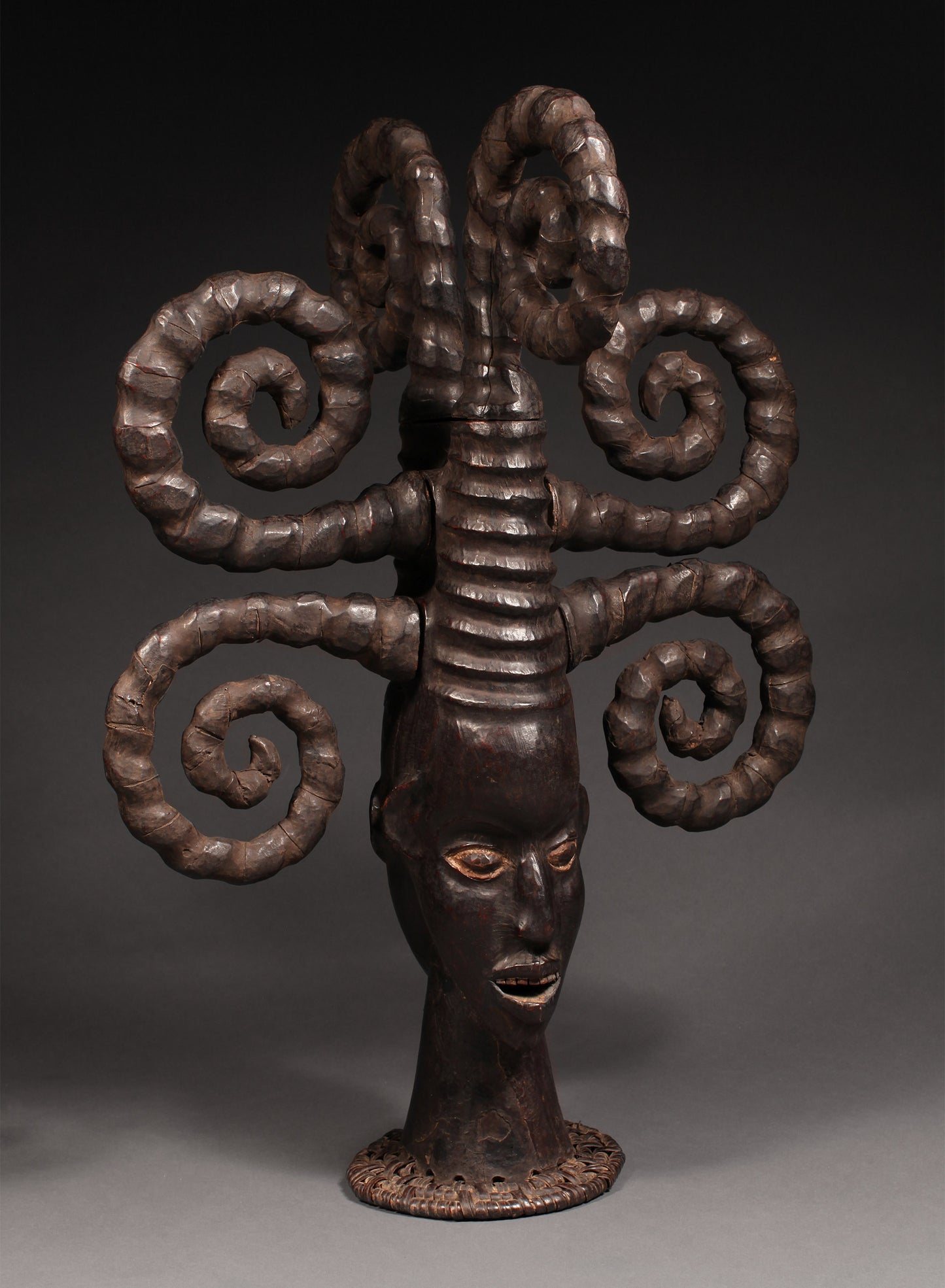 Tribal Masks - Handcrafted - Ekoi Masks - Traditional Folk Art - African Artifacts Sculptures - African Art Collector - This Janus Crest Mask with an elaborate coiffure, crafted by the Ejagham people of the Ekoi tribe in Nigeria, is made of wood and is a unique piece of African art. Its wooden exterior provides strength and durability, while its intricate detailing offers a beautiful addition to any collectors shelf. Height: 34.5"