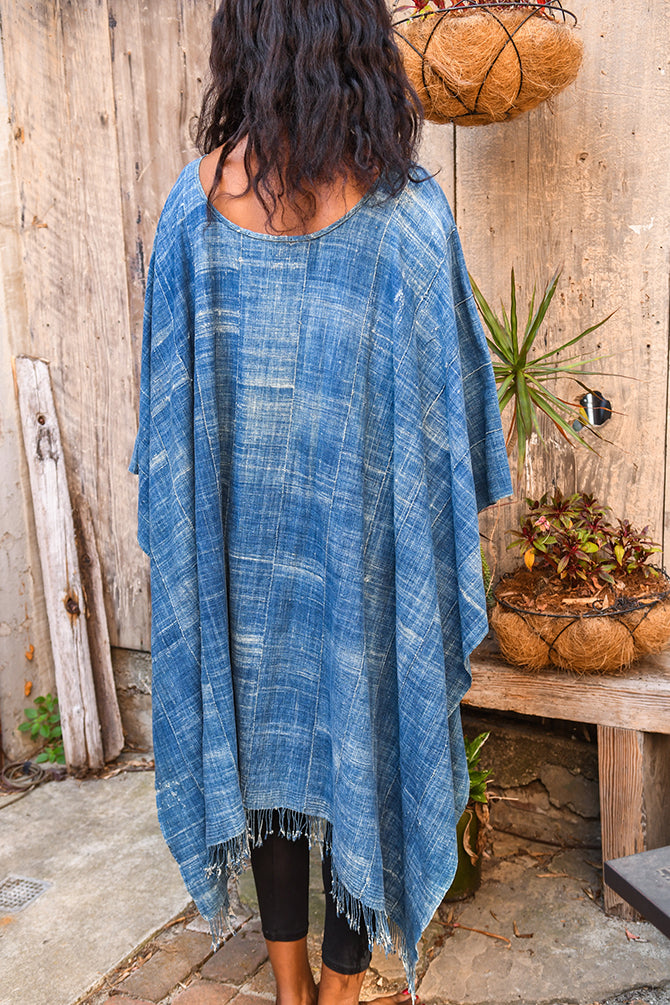Experience traditional African style with our Faded Blue Indigo Poncho. Made with high-quality African textile, this poncho is both stylish and comfortable. Perfect for any occasion, the faded blue color adds a unique touch to any outfit. Elevate your wardrobe with this one-of-a-kind piece.