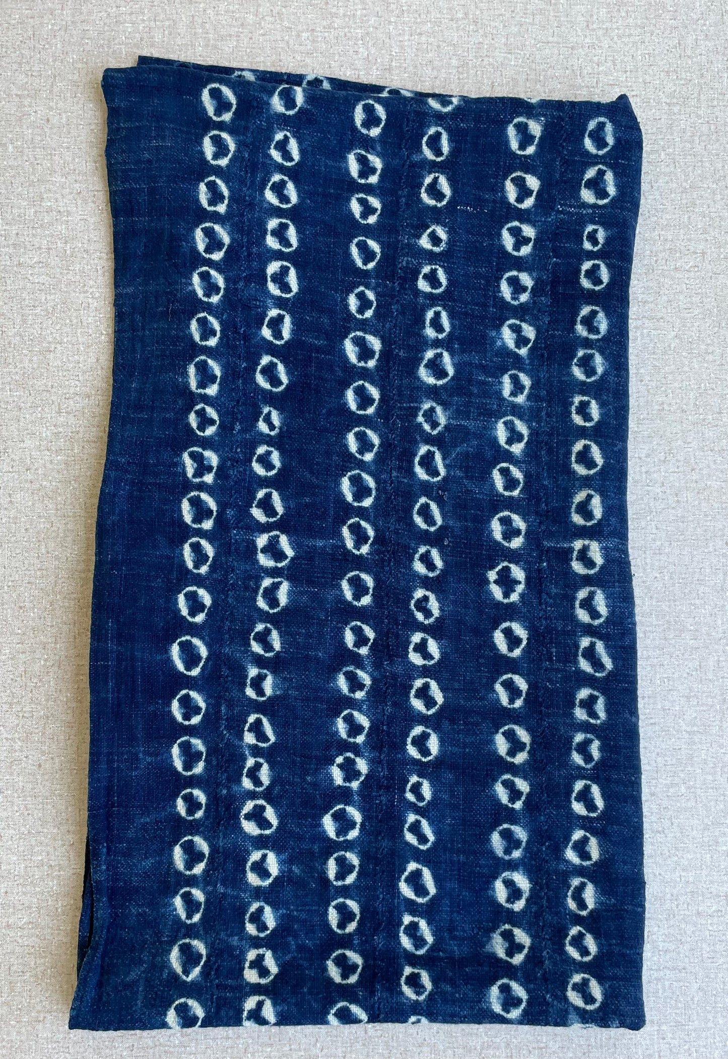 Handcrafted Textiles - Artisan Designed - Handcrafted African Art Textiles - Home Decor - Living Spaces - Mix Colors - Bold Patterns - Traditional Designs - African Culture - This Indigo Shibori Tie Dye Cotton Fabric is a stunning combination of African textile and hand-dyed color. Expertly crafted with attention to detail, this beautiful scarf provides long-lasting durability and a unique flair to any ensemble. Length: 63 inches Width: 24 inches