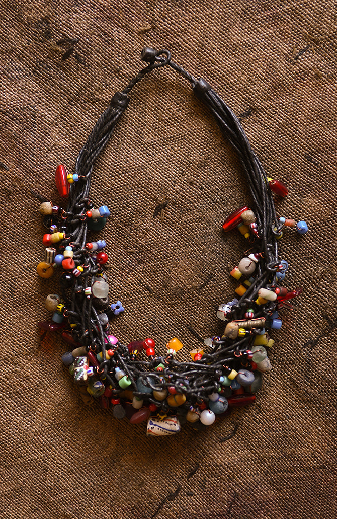 Handcrafted Necklaces - Handmade - African Art - Jewelry - Beaded Necklaces - This stylish necklace is handcrafted with gorgeous African trade beads, creating a bold statement piece that will upgrade any outfit. Perfect for adding a unique touch to your jewelry collection. Length: 10 inches Inventory # 10859