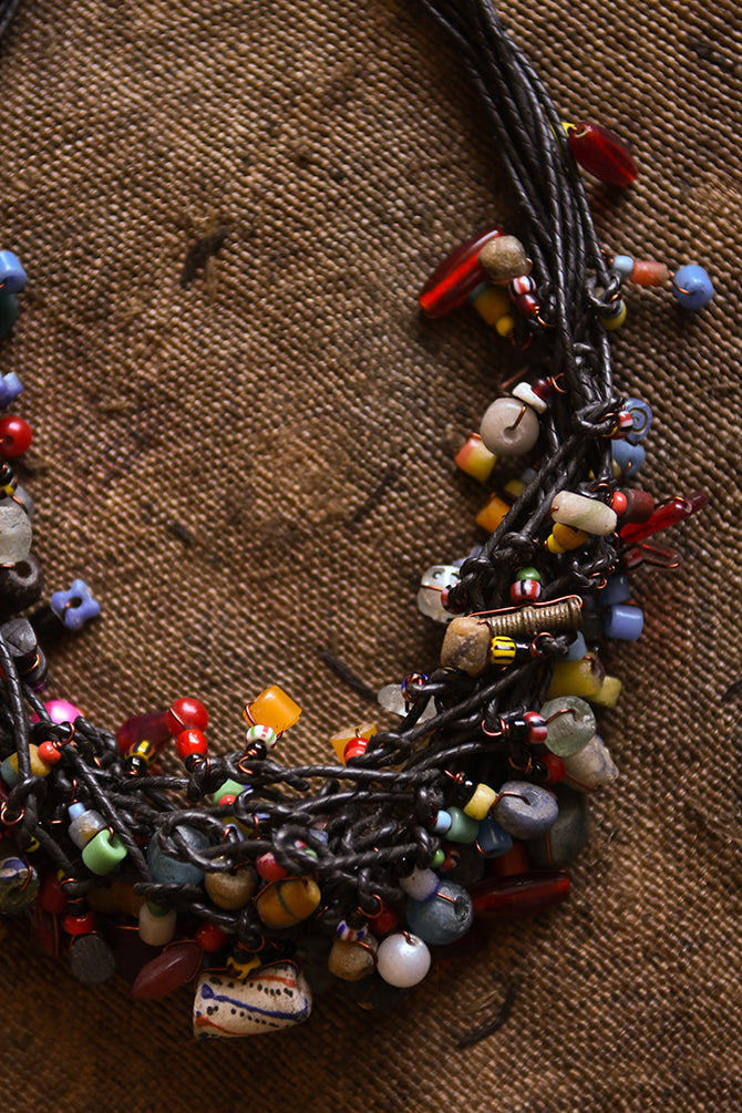 Handcrafted Necklaces - Handmade - African Art - Jewelry - Beaded Necklaces - This stylish necklace is handcrafted with gorgeous African trade beads, creating a bold statement piece that will upgrade any outfit. Perfect for adding a unique touch to your jewelry collection. Length: 10 inches Inventory # 10859