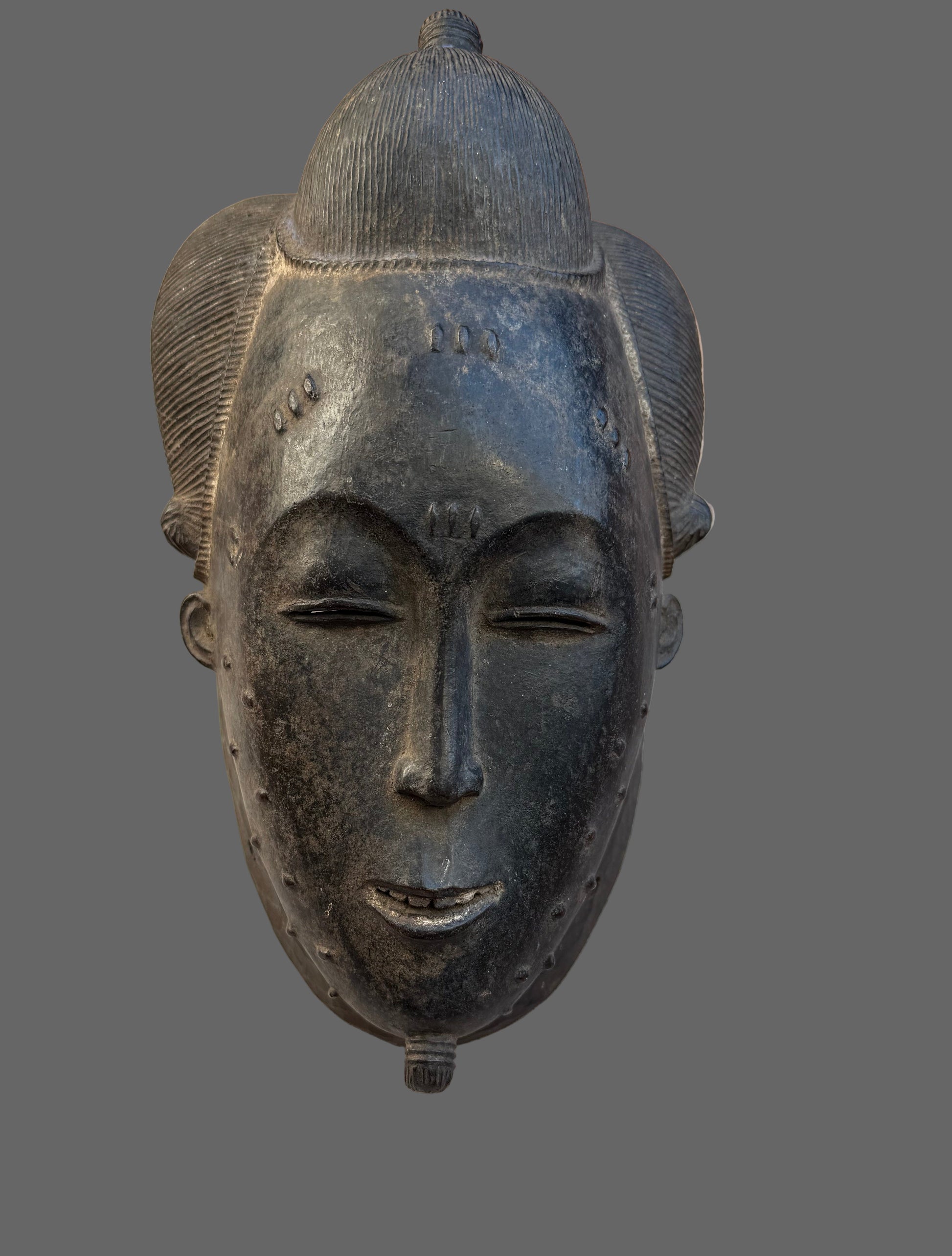 Decorative mask on a wooden surface