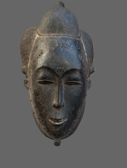 Decorative mask on a wooden surface