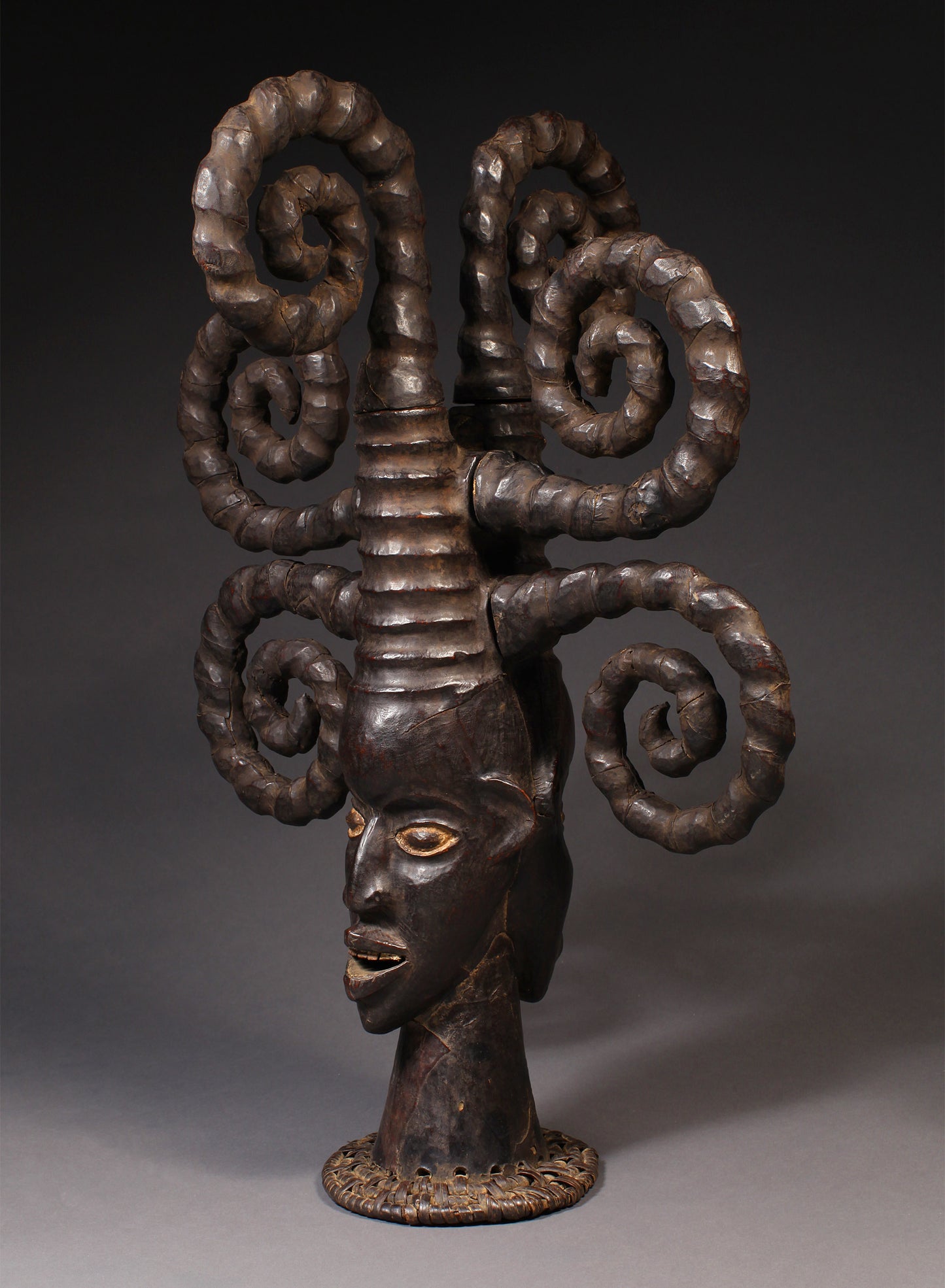 Tribal Masks - Handcrafted - Ekoi Masks - Traditional Folk Art - African Artifacts Sculptures - African Art Collector - This Janus Crest Mask with an elaborate coiffure, crafted by the Ejagham people of the Ekoi tribe in Nigeria, is made of wood and is a unique piece of African art. Its wooden exterior provides strength and durability, while its intricate detailing offers a beautiful addition to any collectors shelf. Height: 34.5"