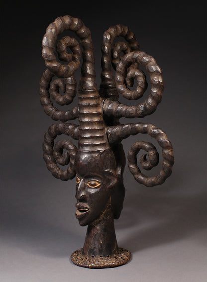 Tribal Masks - Handcrafted - Ekoi Masks - Traditional Folk Art - African Artifacts Sculptures - African Art Collector - This Janus Crest Mask with an elaborate coiffure, crafted by the Ejagham people of the Ekoi tribe in Nigeria, is made of wood and is a unique piece of African art. Its wooden exterior provides strength and durability, while its intricate detailing offers a beautiful addition to any collectors shelf. Height: 34.5"