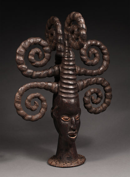 Tribal Masks - Handcrafted - Ekoi Masks - Traditional Folk Art - African Artifacts Sculptures - African Art Collector - This Janus Crest Mask with an elaborate coiffure, crafted by the Ejagham people of the Ekoi tribe in Nigeria, is made of wood and is a unique piece of African art. Its wooden exterior provides strength and durability, while its intricate detailing offers a beautiful addition to any collectors shelf. Height: 34.5"