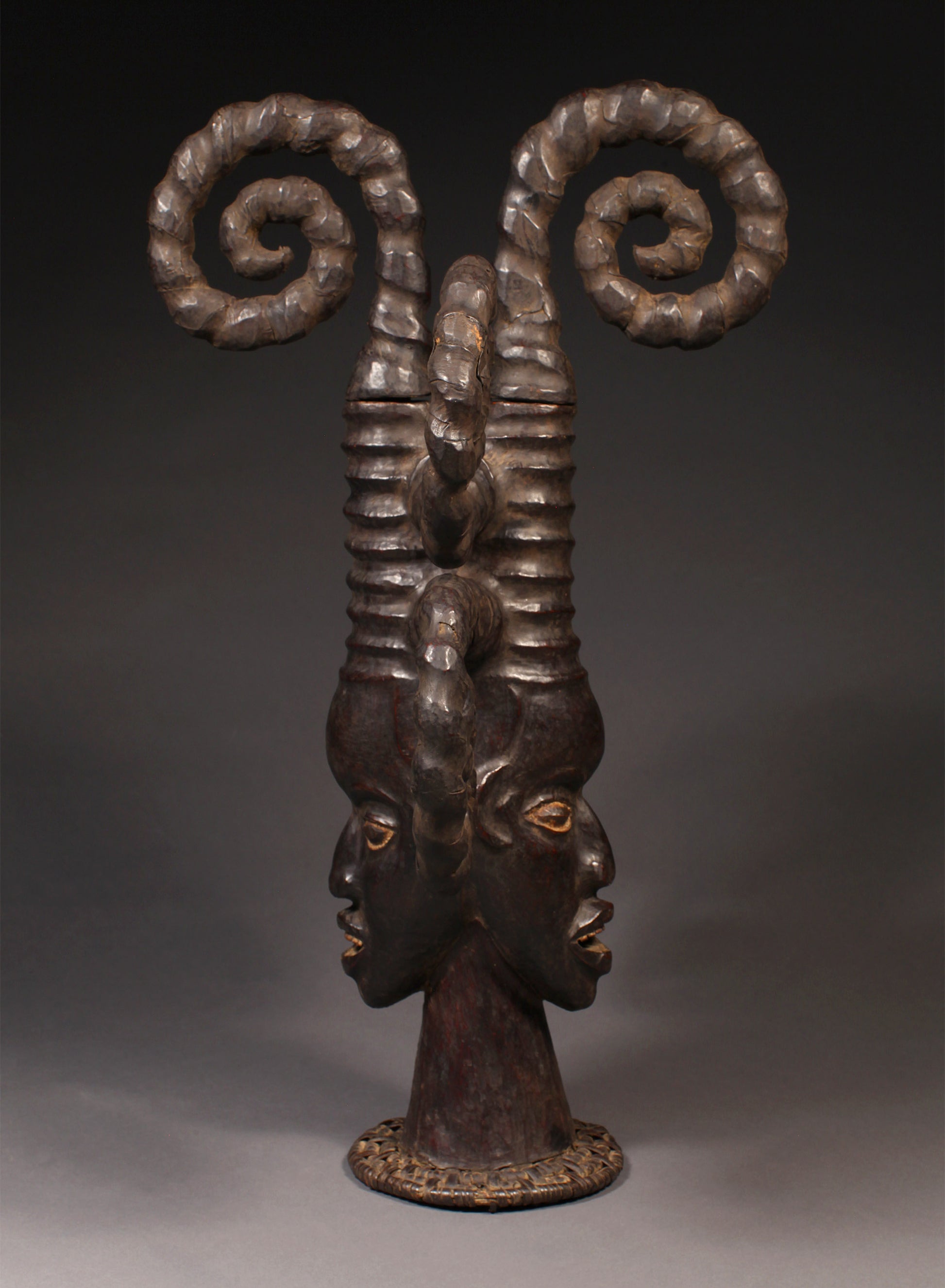 Tribal Masks - Handcrafted - Ekoi Masks - Traditional Folk Art - African Artifacts Sculptures - African Art Collector - This Janus Crest Mask with an elaborate coiffure, crafted by the Ejagham people of the Ekoi tribe in Nigeria, is made of wood and is a unique piece of African art. Its wooden exterior provides strength and durability, while its intricate detailing offers a beautiful addition to any collectors shelf. Height: 34.5"