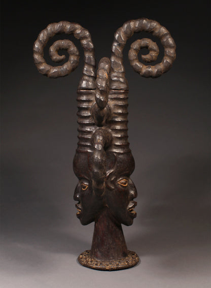 Tribal Masks - Handcrafted - Ekoi Masks - Traditional Folk Art - African Artifacts Sculptures - African Art Collector - This Janus Crest Mask with an elaborate coiffure, crafted by the Ejagham people of the Ekoi tribe in Nigeria, is made of wood and is a unique piece of African art. Its wooden exterior provides strength and durability, while its intricate detailing offers a beautiful addition to any collectors shelf. Height: 34.5"