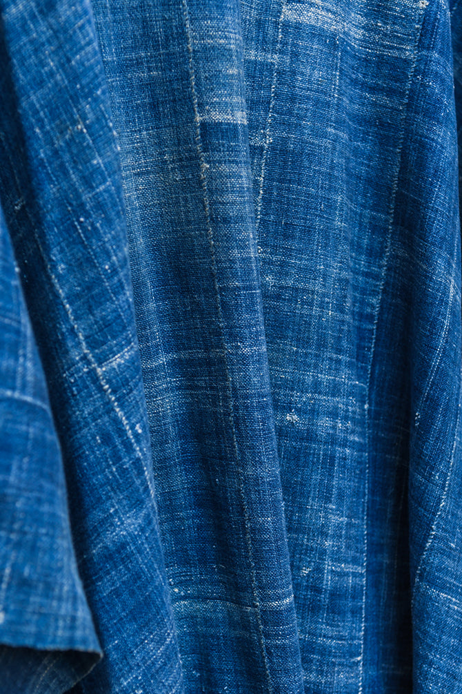Experience traditional African style with our Faded Blue Indigo Poncho. Made with high-quality African textile, this poncho is both stylish and comfortable. Perfect for any occasion, the faded blue color adds a unique touch to any outfit. Elevate your wardrobe with this one-of-a-kind piece.