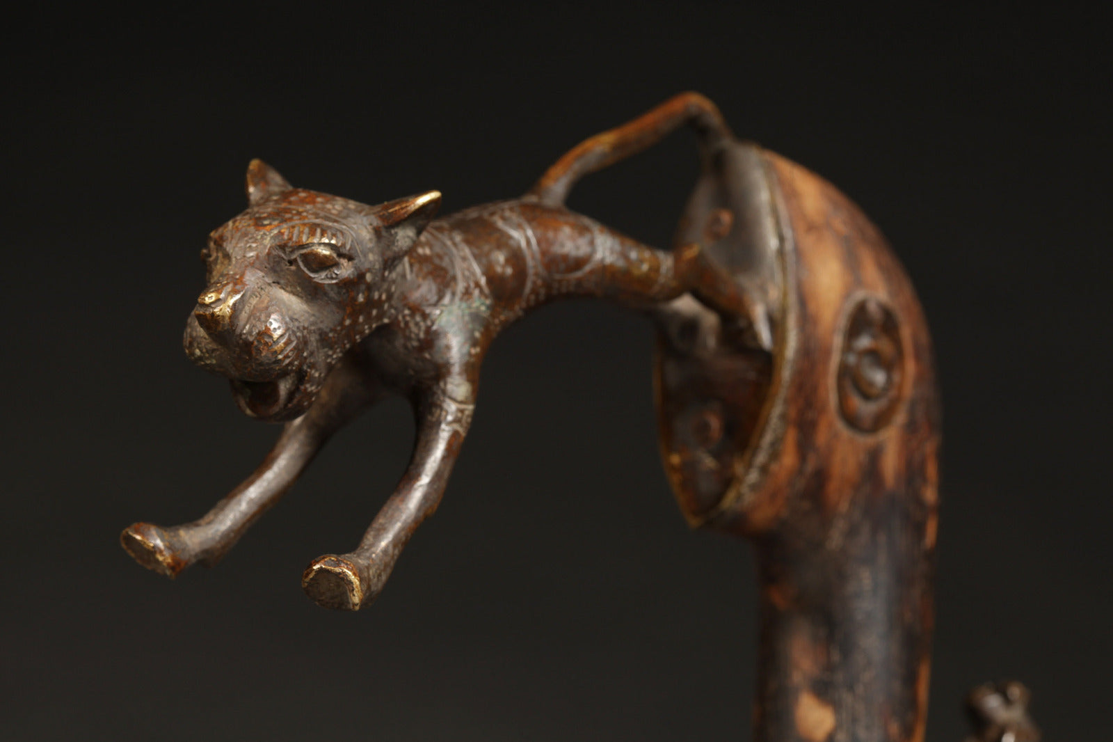 Tribal Objects - African Tribal Art - Ancient Ceremonial Art - Handcrafted Artifacts - Masks - Wood Sculptures - Iron Bronze Objects - Textiles - Art Pieces - African Folk Art - This Zoomorphic Prestige Staff Scepter is a stunning piece of African art. Carved by the Fon tribe of Republic of Benin, this scepter is made of wood, bronze, and brass. Highly sought after by collectors, this artifact is an exquisite example of tribal sculptures. Height: 23" Inventory # 10393