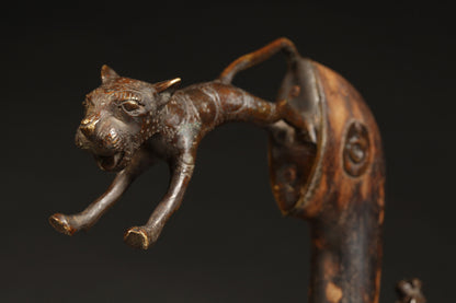 Tribal Objects - African Tribal Art - Ancient Ceremonial Art - Handcrafted Artifacts - Masks - Wood Sculptures - Iron Bronze Objects - Textiles - Art Pieces - African Folk Art - This Zoomorphic Prestige Staff Scepter is a stunning piece of African art. Carved by the Fon tribe of Republic of Benin, this scepter is made of wood, bronze, and brass. Highly sought after by collectors, this artifact is an exquisite example of tribal sculptures. Height: 23" Inventory # 10393