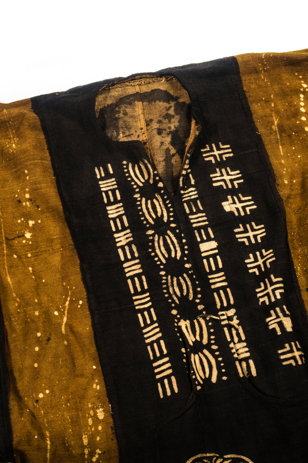 Handcrafted Mudcloth Clothing - African Art - Handmade - Clothing - This Dyed Black Brown Mudcloth Poncho adds a unique, authentic African aesthetic to any ensemble. Crafted with artisanal dying processes and traditional weaving methods, Cotton Bogolan fabric ensures every piece is one-of-a-kind. The natural, handmade look adds an exotic, eye-catching flair to any wardrobe.  Large, Unisex  Full Length: 55"  Inventory # 10715