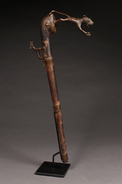 Tribal Objects - African Tribal Art - Ancient Ceremonial Art - Handcrafted Artifacts - Masks - Wood Sculptures - Iron Bronze Objects - Textiles - Art Pieces - African Folk Art - This Zoomorphic Prestige Staff Scepter is a stunning piece of African art. Carved by the Fon tribe of Republic of Benin, this scepter is made of wood, bronze, and brass. Highly sought after by collectors, this artifact is an exquisite example of tribal sculptures. Height: 23" Inventory # 10393