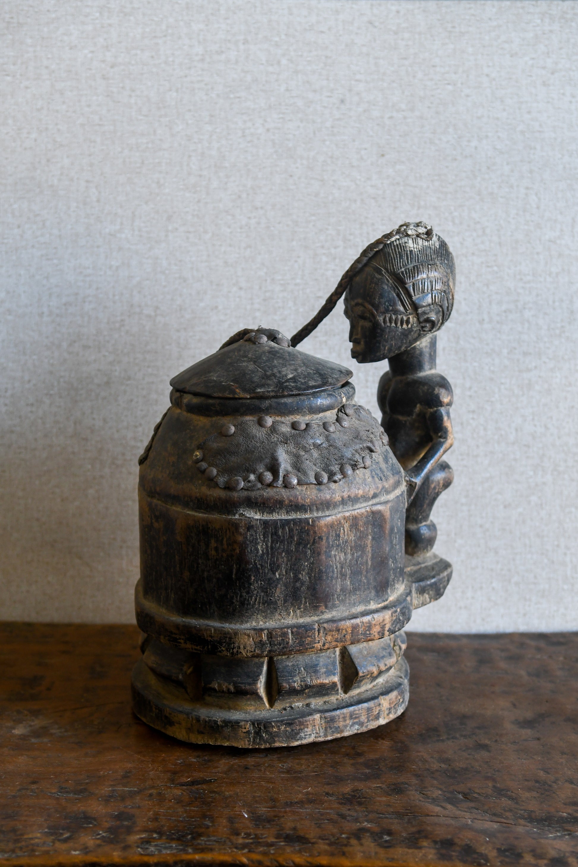 Tribal Objects - African Tribal Art - Ancient Ceremonial Art - Handcrafted Artifacts - Masks - Wood Sculptures - Iron Bronze Objects - Textiles - Art Pieces - African Folk Art - This unique Baule Divination Bowl Figure is an authentic piece of African art. It is an old carved wooden figure, crafted by highly skilled artisans, and is sure to make a statement in any space. The Divination Lidded Vessel Bowl is a perfect addition to any collection of sculptures and objects.Height : 15 inchesDepth: 4 inches