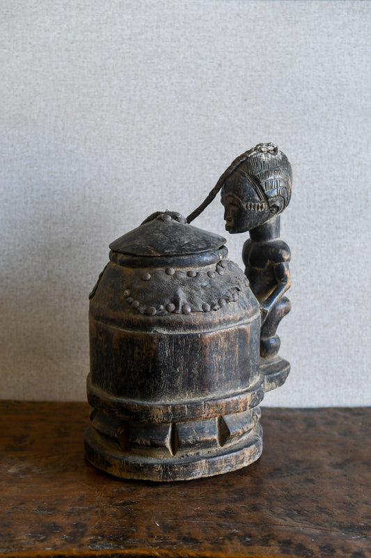 Tribal Objects - African Tribal Art - Ancient Ceremonial Art - Handcrafted Artifacts - Masks - Wood Sculptures - Iron Bronze Objects - Textiles - Art Pieces - African Folk Art - This unique Baule Divination Bowl Figure is an authentic piece of African art. It is an old carved wooden figure, crafted by highly skilled artisans, and is sure to make a statement in any space. The Divination Lidded Vessel Bowl is a perfect addition to any collection of sculptures and objects.Height : 15 inchesDepth: 4 inches