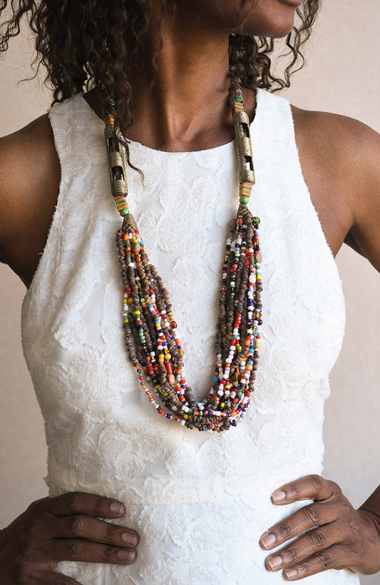 Handcrafted Necklaces - Handmade - African Art - Jewelry - Beaded Necklaces - This unique Beaded Statement Necklace is handmade from African trade beads for a truly one-of-a-kind look. The Tribal African design adds an eye-catching and authentic element to your wardrobe. Perfect for special occasions or everyday wear. Length: 17" Inventory # 10830