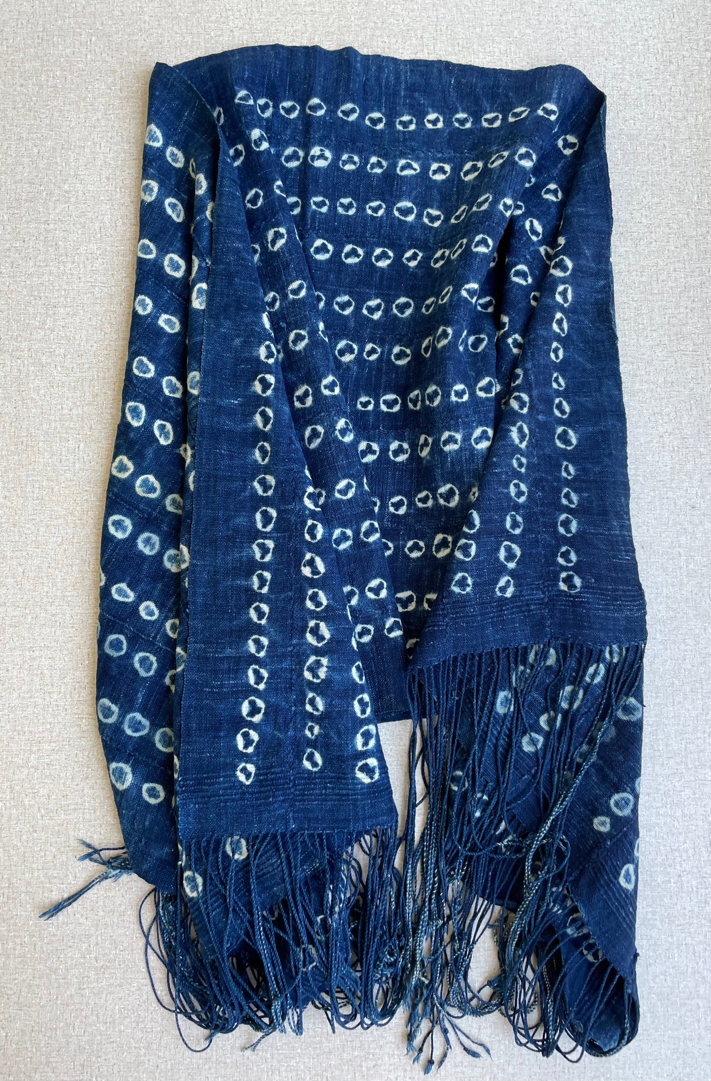 Handcrafted Textiles - Artisan Designed - Handcrafted African Art Textiles - Home Decor - Living Spaces - Mix Colors - Bold Patterns - Traditional Designs - African Culture - This Indigo Shibori Tie Dye Cotton Fabric is a stunning combination of African textile and hand-dyed color. Expertly crafted with attention to detail, this beautiful scarf provides long-lasting durability and a unique flair to any ensemble.  Length: 63 inches  Width: 24 inches