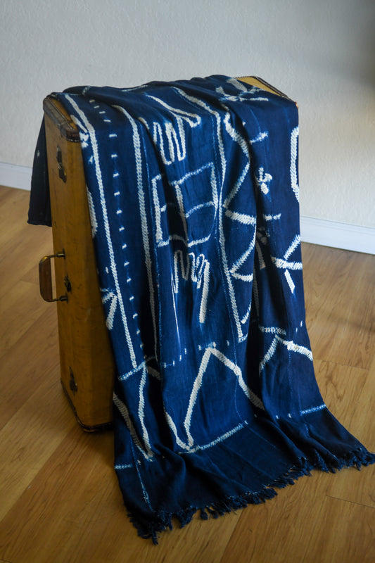 Handcrafted Textiles - Artisan Designed - Handcrafted African Art Textiles - Home Decor - Living Spaces - Mix Colors - Bold Patterns - Traditional Designs - African Culture - Indigo Tie Dyed Textile, featuring a Vintage African Fabric design, is a one-of-a-kind product. It is hand crafted using traditional methods of tie dyeing, resulting in a unique and timeless article of clothing.  Length: 61  Width: 42