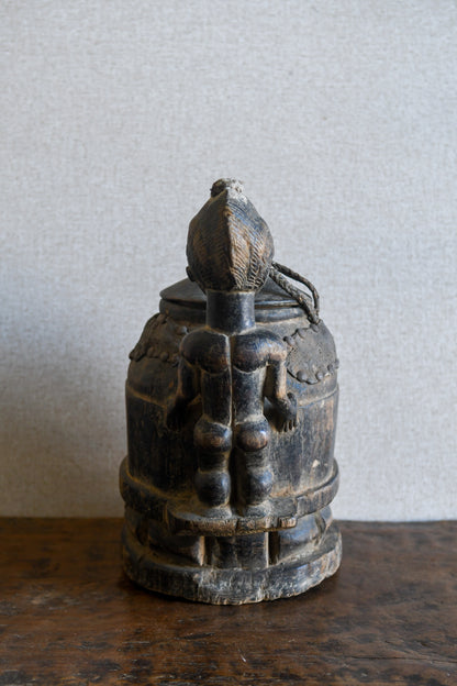 Tribal Objects - African Tribal Art - Ancient Ceremonial Art - Handcrafted Artifacts - Masks - Wood Sculptures - Iron Bronze Objects - Textiles - Art Pieces - African Folk Art - This unique Baule Divination Bowl Figure is an authentic piece of African art. It is an old carved wooden figure, crafted by highly skilled artisans, and is sure to make a statement in any space. The Divination Lidded Vessel Bowl is a perfect addition to any collection of sculptures and objects.Height : 15 inchesDepth: 4 inches