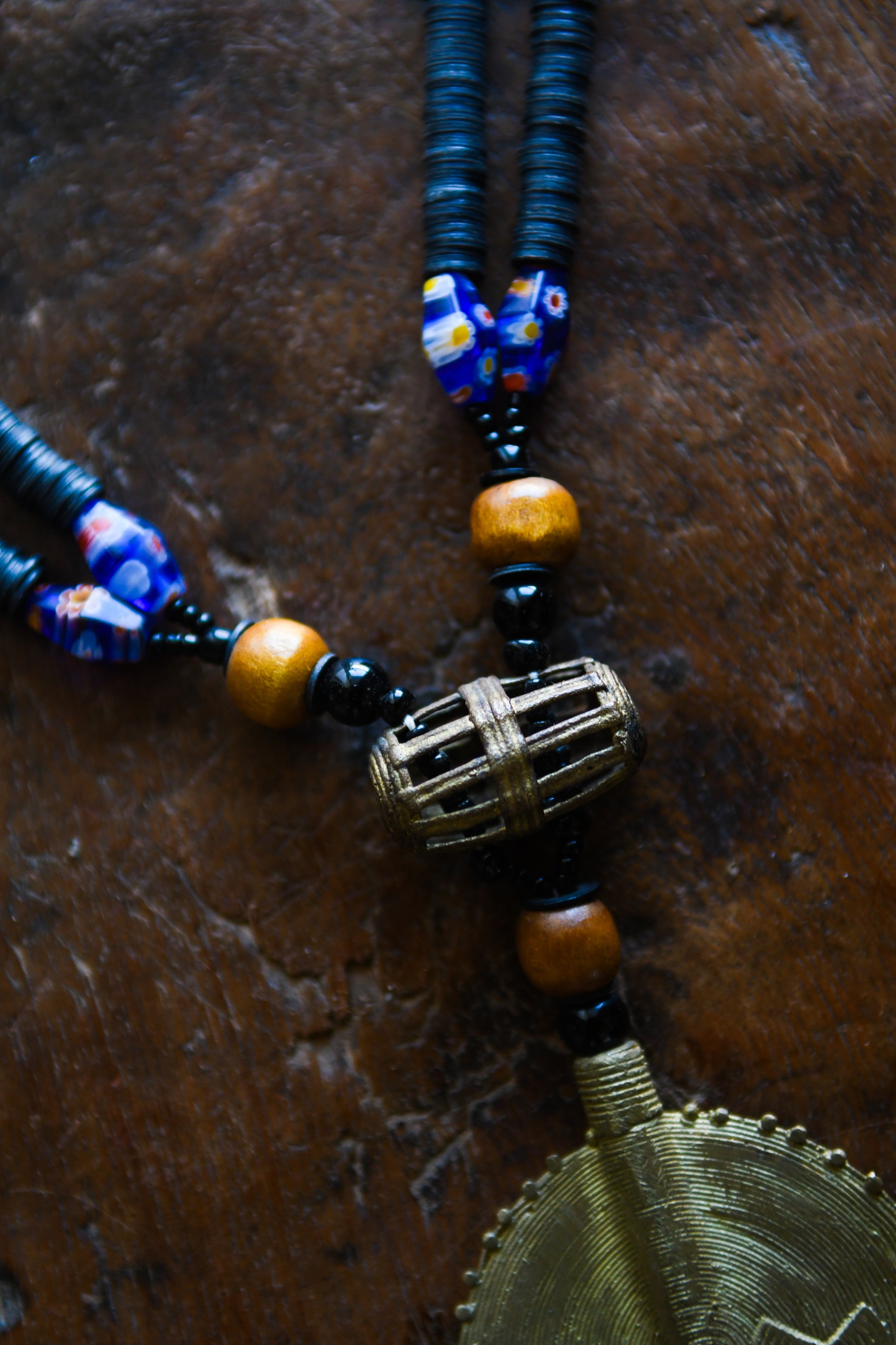 Tribal Necklaces - Handmade - African Art - Jewelry - Traditional - African Necklaces - Beaded - Collectible Necklaces - This Tribal Beads Bronze Pendant Necklace will add flair to any outfit. Crafted from bronze and featuring a unique African tribal design, it is sure to become a conversation starter. Enjoy this striking piece of jewelry and make a statement wherever you go. Length: 21 inches