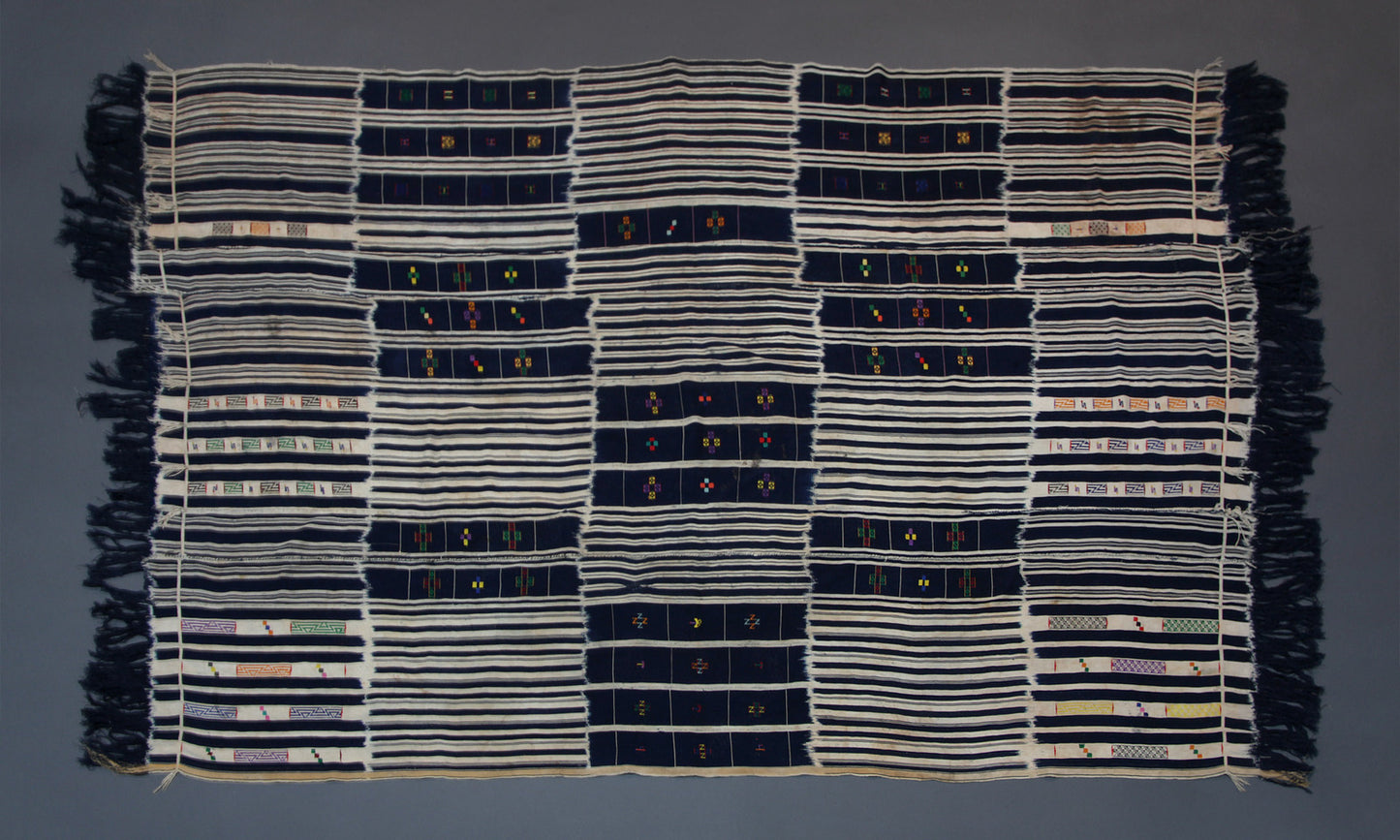 Handwoven Baule tribe cotton ikat wrap cloth from Ivory Coast styled as wall decor tapestry