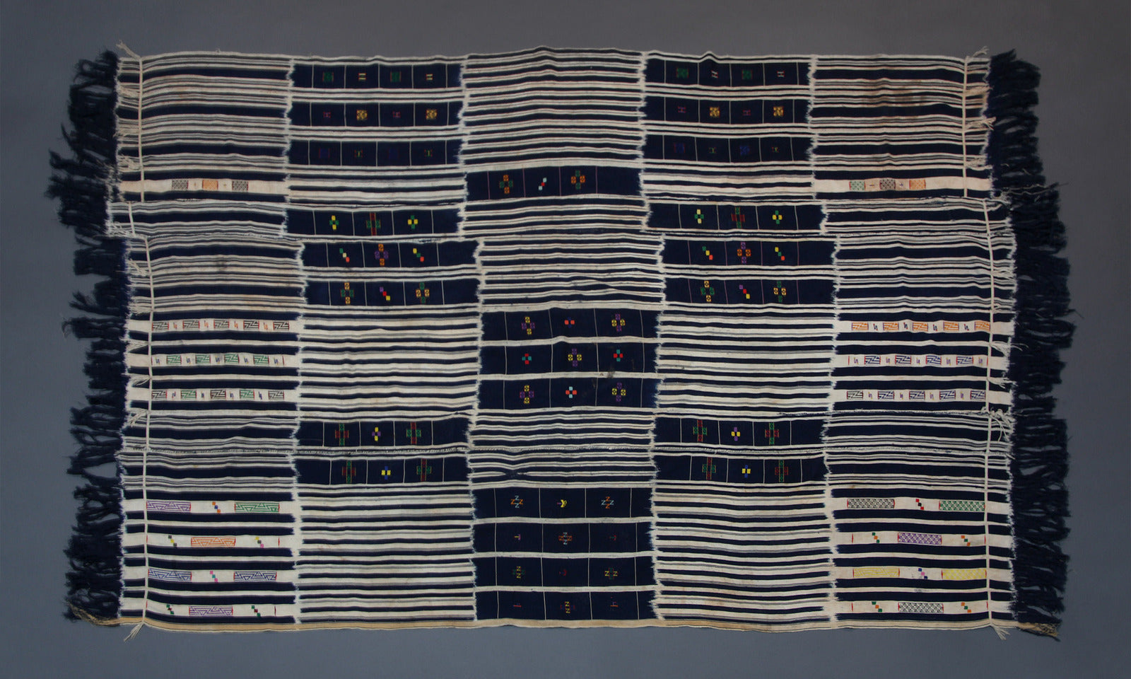 Handwoven Baule tribe cotton ikat wrap cloth from Ivory Coast styled as wall decor tapestry