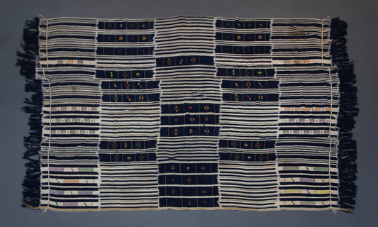 Handwoven Baule tribe cotton ikat wrap cloth from Ivory Coast styled as wall decor tapestry