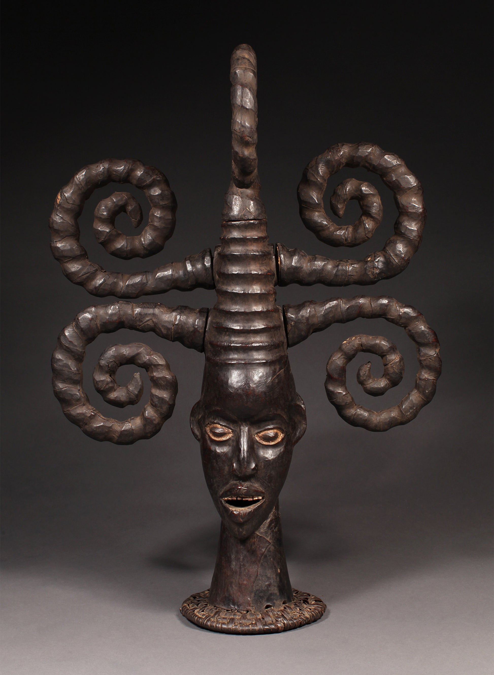 Tribal Masks - Handcrafted - Ekoi Masks - Traditional Folk Art - African Artifacts Sculptures - African Art Collector - This Janus Crest Mask with an elaborate coiffure, crafted by the Ejagham people of the Ekoi tribe in Nigeria, is made of wood and is a unique piece of African art. Its wooden exterior provides strength and durability, while its intricate detailing offers a beautiful addition to any collectors shelf. Height: 34.5"
