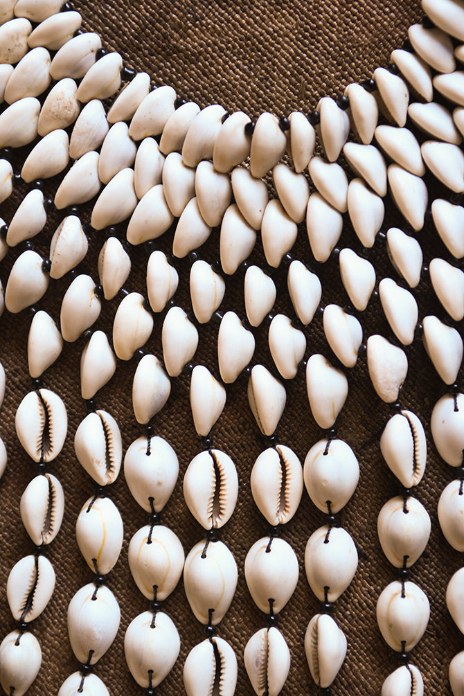 Handcrafted Necklaces - Handmade - African Art - Jewelry - Beaded Necklaces - This Statement Cowrie Shell Necklace is crafted with Authentic Cowrie Shell Beads for a unique and beautiful look.It is a unique piece of African Tribal Jewelry, sure to make a statement. Handmade with love, this is the perfect accessory for any wardrobe. Length: 18" Inventory # 10826