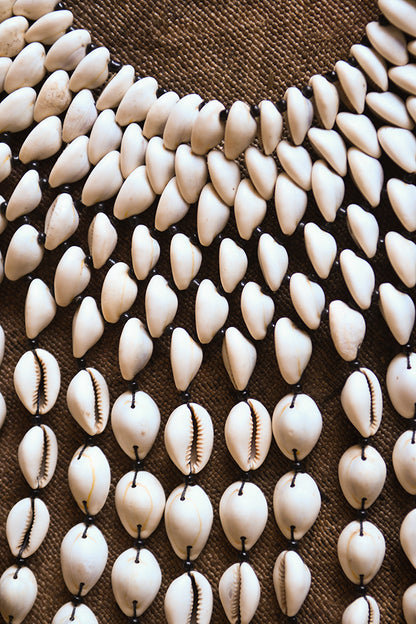 Handcrafted Necklaces - Handmade - African Art - Jewelry - Beaded Necklaces - This Statement Cowrie Shell Necklace is crafted with Authentic Cowrie Shell Beads for a unique and beautiful look.It is a unique piece of African Tribal Jewelry, sure to make a statement. Handmade with love, this is the perfect accessory for any wardrobe. Length: 18" Inventory # 10826