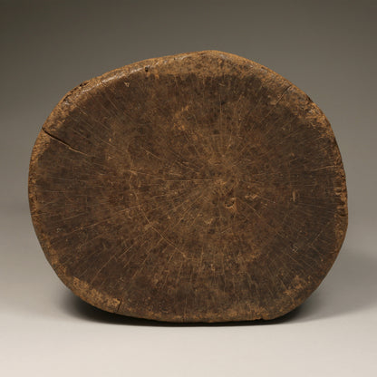 Tribal Furniture - A unique piece of art, this Old Senufo Wood Stool is a stunning example of traditional Ivory Coast craftsmanship. Boasting intricate geometric carvings, this stool is sure to be a conversation starter.